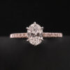 Elegant Oval-Cut Diamond Engagement Ring with Pave Band